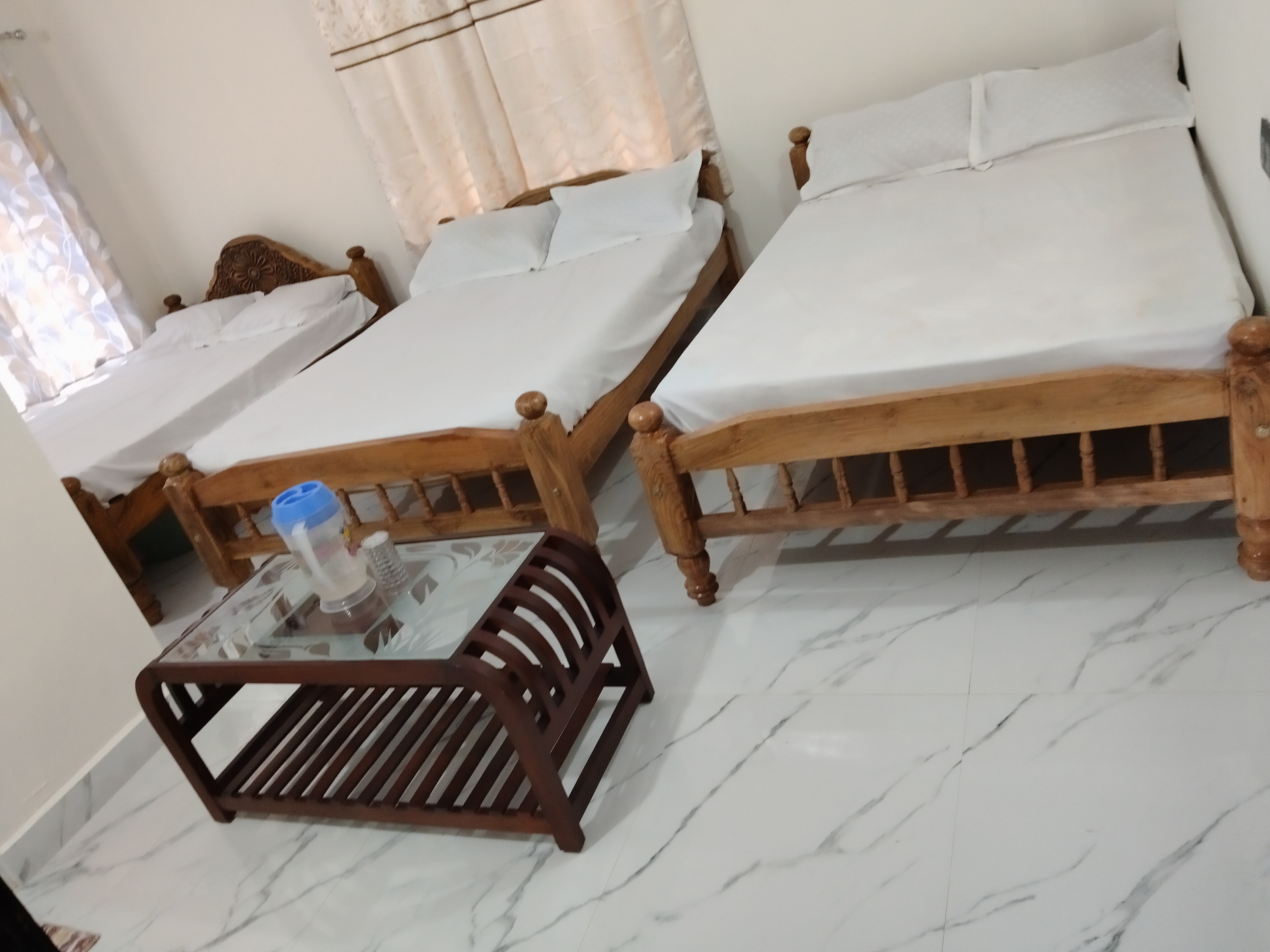 Family room with multiple beds at Nooji Homestay